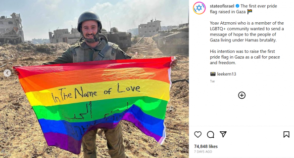 Kuvakaappaus Israelin valtion Instagram-tililtä: Sotilas seisoo raunioiden edessä ja pitelee pride-lippua, jossa lukee "In the Name of Love".