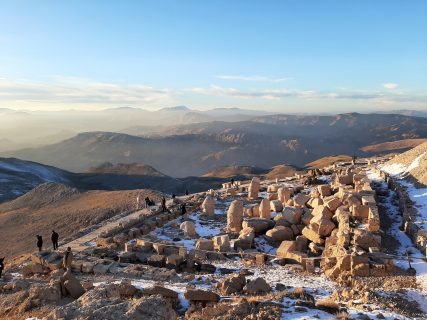 Picture of Nemrut archeological site with mountains on the background